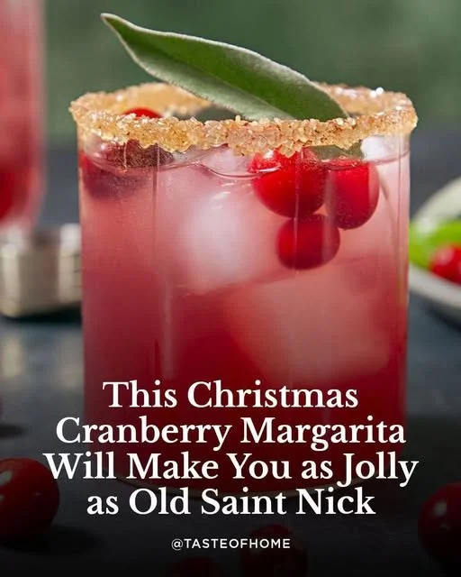 Cranberry Margarita A vibrant cranberry margarita served in a glass with a lime garnish.