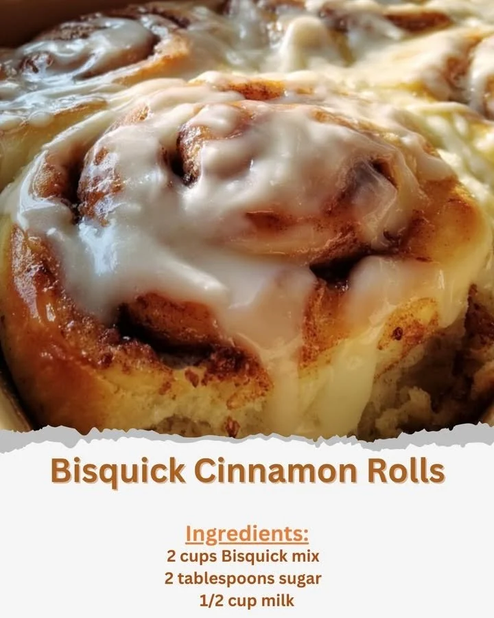 Bisquick Cinnamon Rolls Freshly baked Bisquick cinnamon rolls with drizzled icing on top.