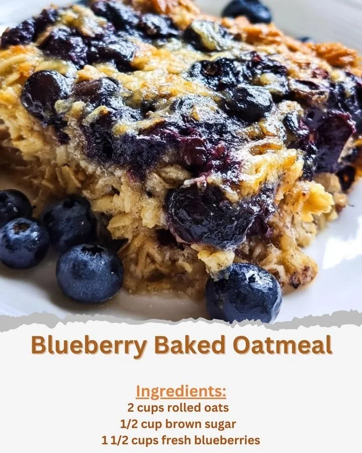 Blueberry Baked Oatmeal A bowl of warm blueberry baked oatmeal topped with fresh berries and nuts.
