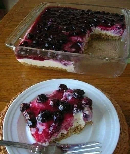 Blueberry Cheesecake Delicious slice of blueberry cheesecake topped with fresh blueberries