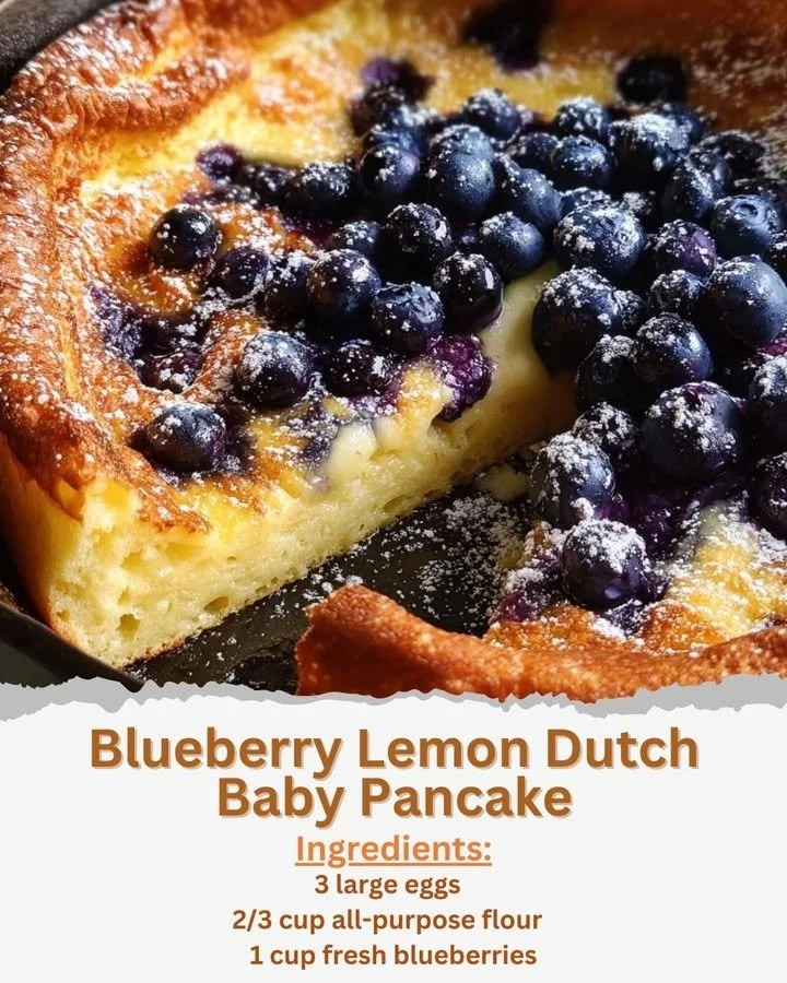 Blueberry Lemon Dutch Baby Pancake Fluffy Blueberry Lemon Dutch Baby Pancake served on a white plate