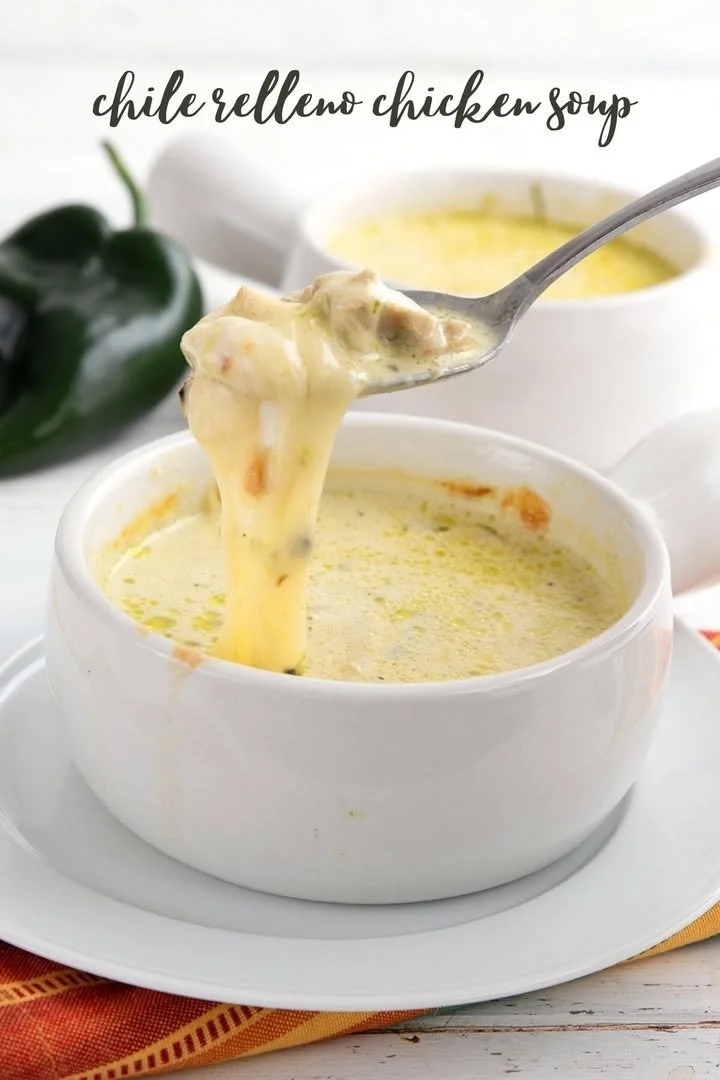 Delicious stuffed chile chicken soup served in a bowl, garnished with herbs.