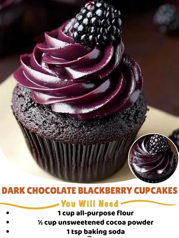 Delicious dark chocolate blackberry cupcakes topped with fresh blackberries.