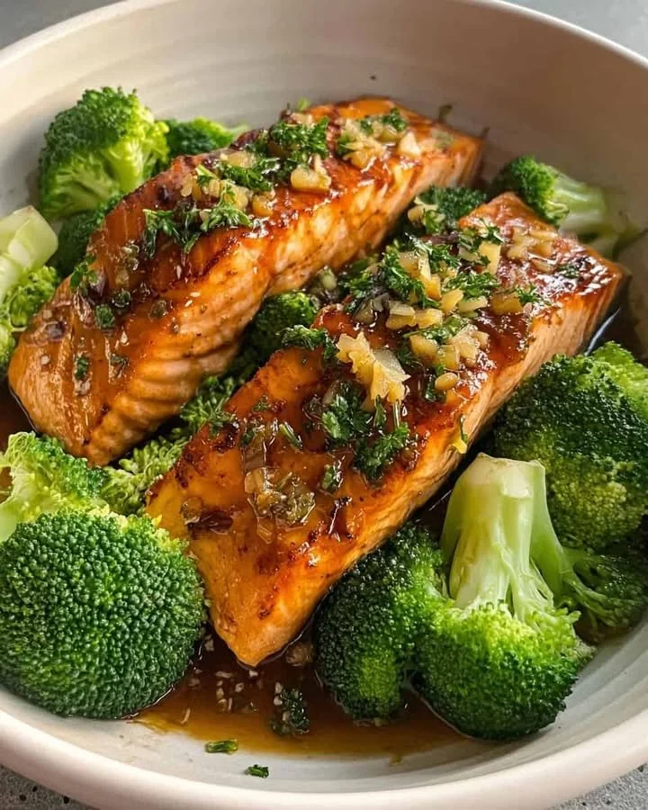Garlic Glazed Salmon & Broccoli Power Plate Garlic Glazed Salmon served with broccoli on a vibrant plate