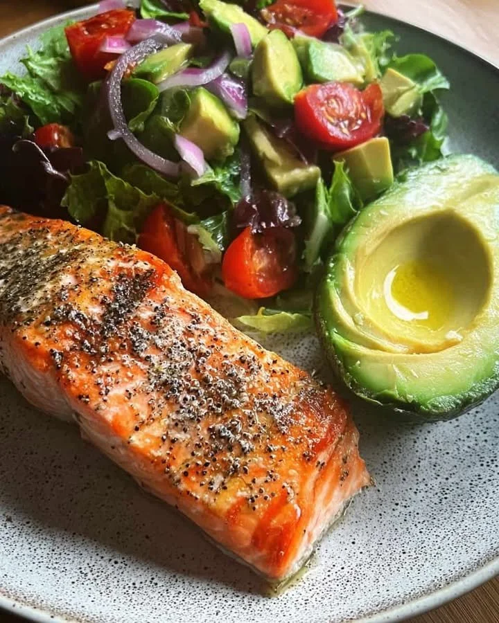 Lemon Pepper Salmon served with a fresh Avocado Garden Salad