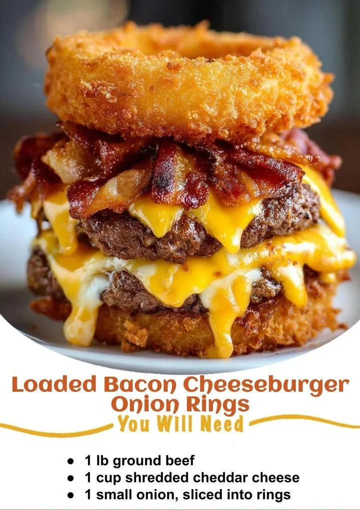 Loaded bacon cheeseburger with onion rings served on a plate