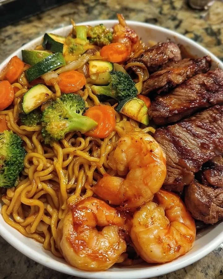 Loaded Hibachi Steak & Shrimp Yakisoba Noodles Delicious Loaded Hibachi Steak & Shrimp Yakisoba Noodles served in a bowl