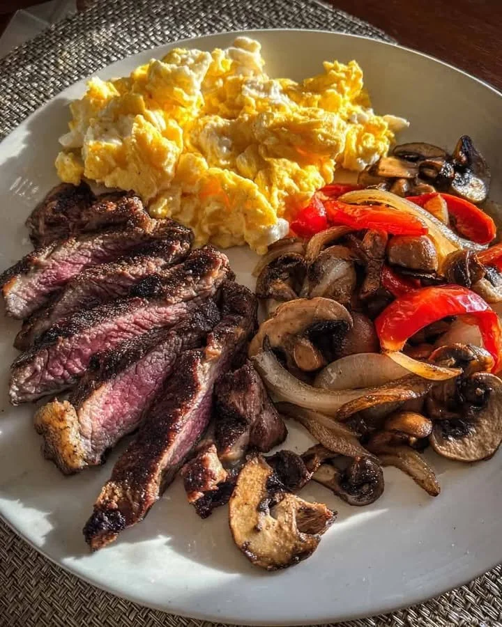 Steakhouse Breakfast Plate Delicious steakhouse breakfast plate with steak, eggs, and sides